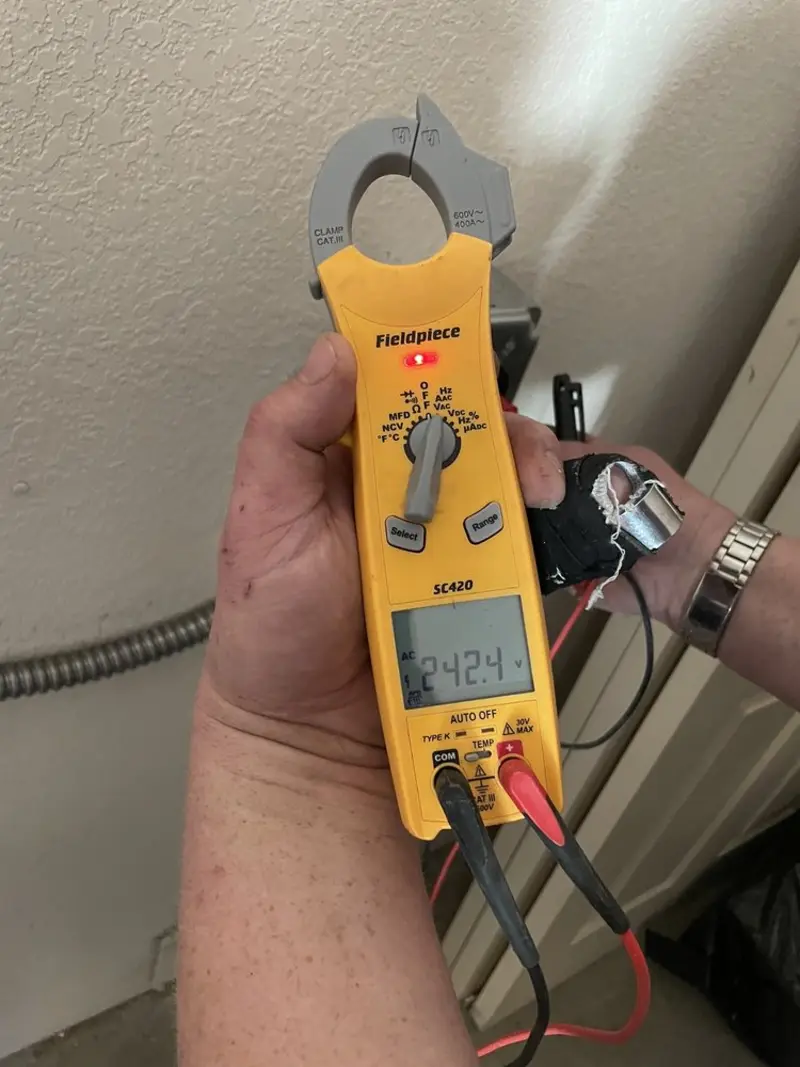 Voltage testing with clamp meter during Circuit Breaker Repair in Caroline